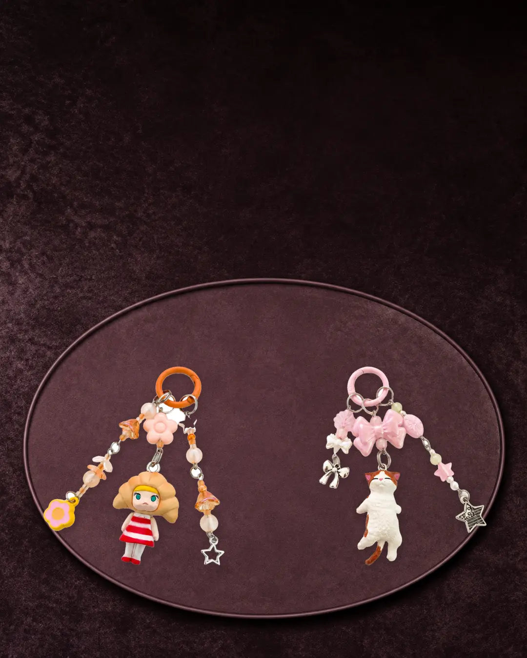 Croissant Girl and Orange and White Cat beaded bag charm keychains from Gugu Collects